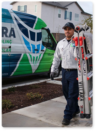 Technician carrying ladder